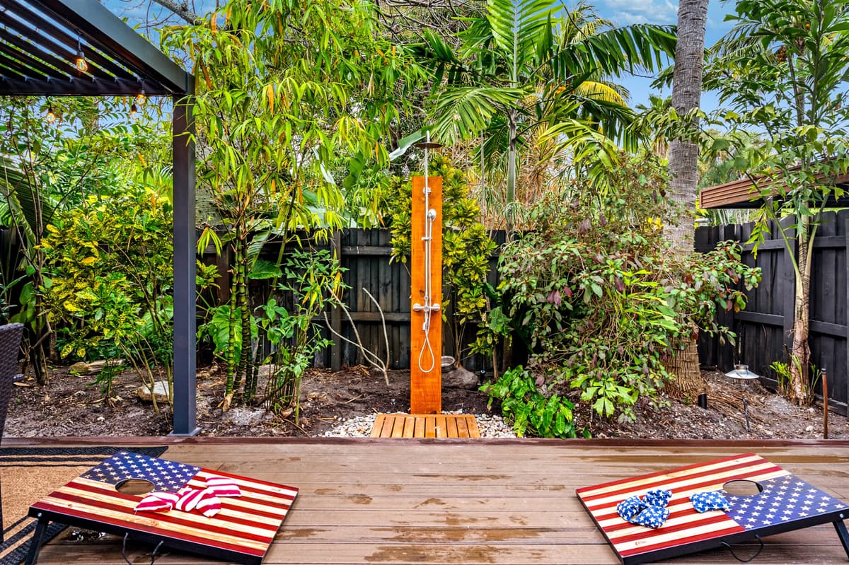 Bags flying and bragging rights on the line — cornhole time 🎯.  Rinse off in the outside shower South Florida style!🌴