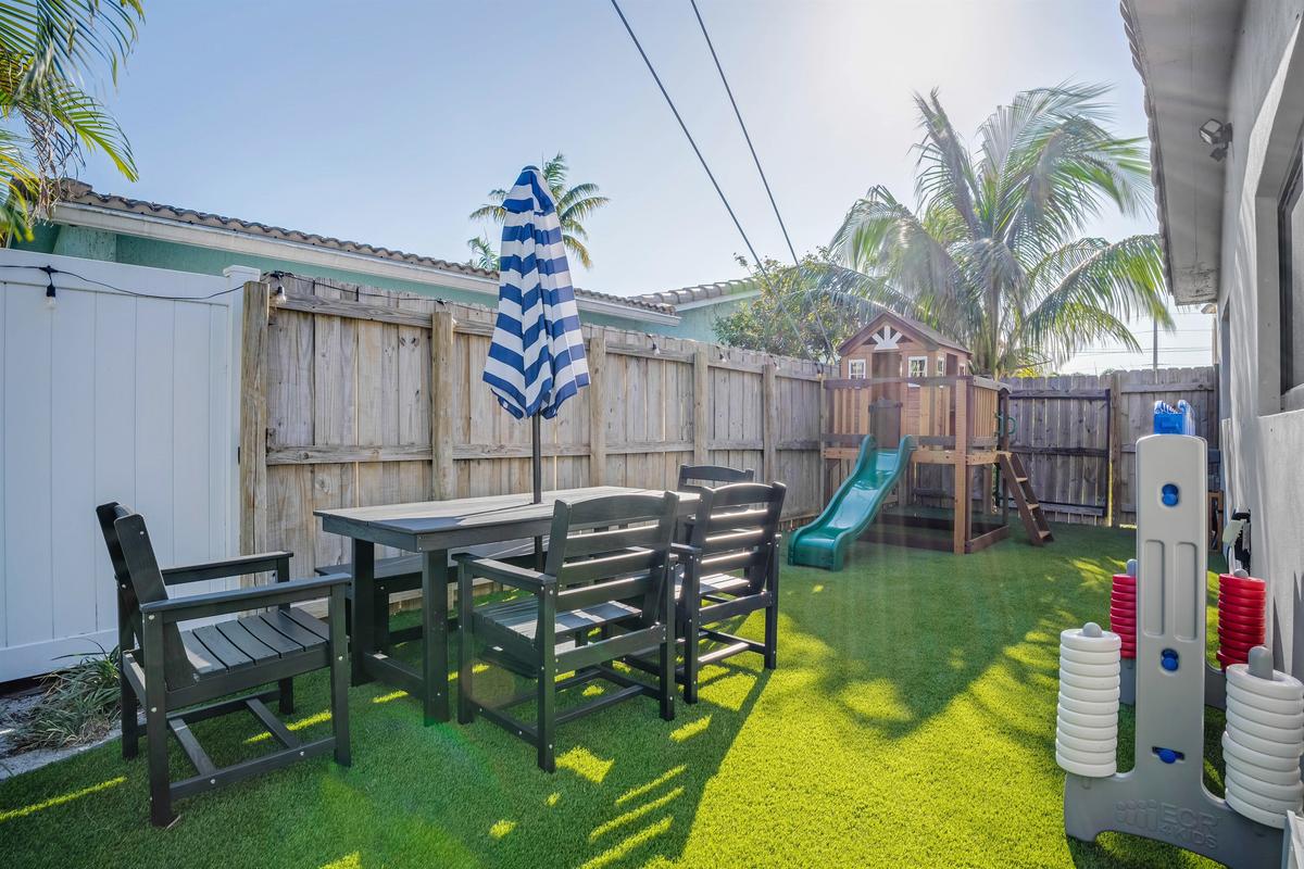 Don't worry about entertaining the kids, relax at the shaded table while they play nearby