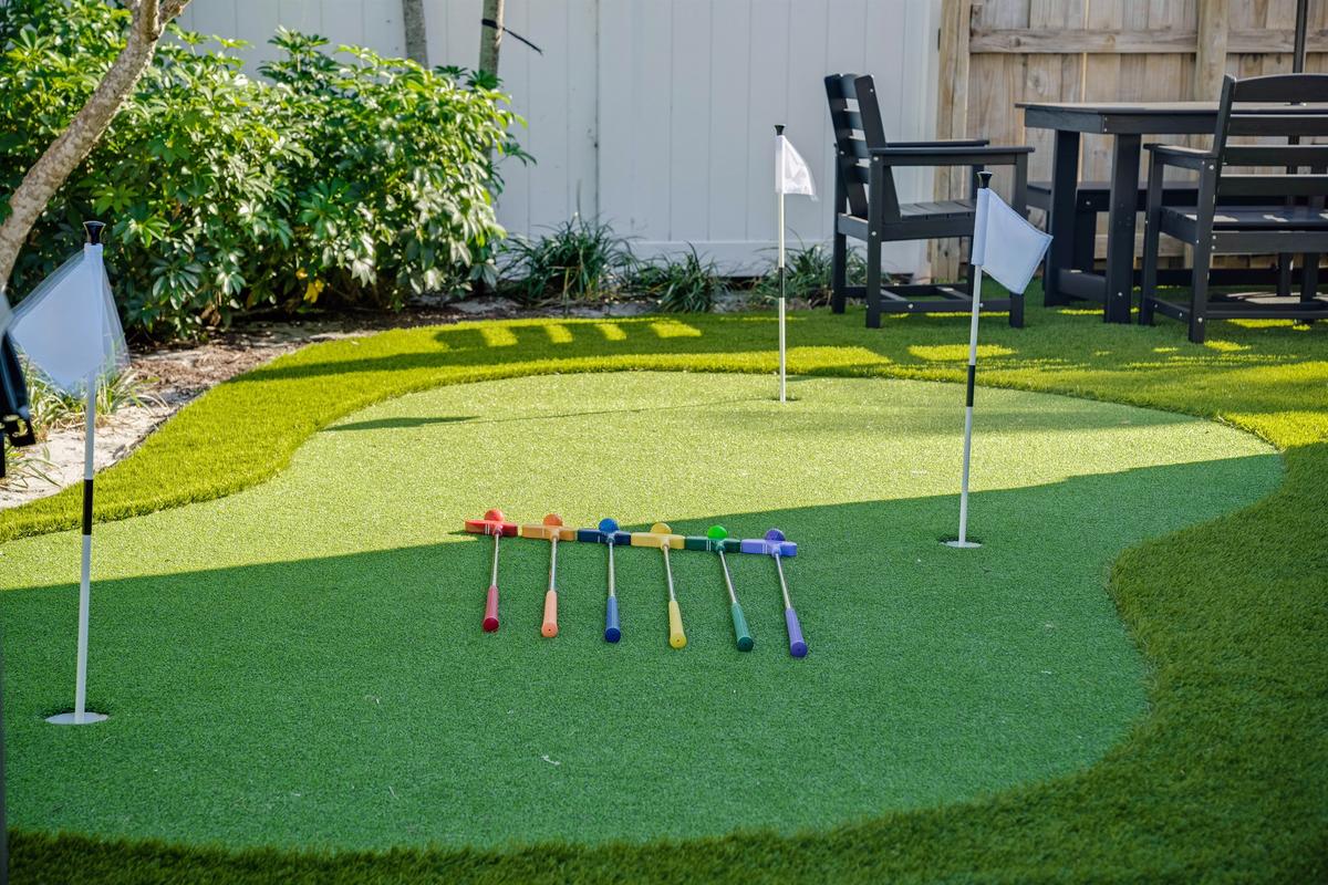 ⛳ Practice your short game or challenge the crew — the backyard is a vibe.