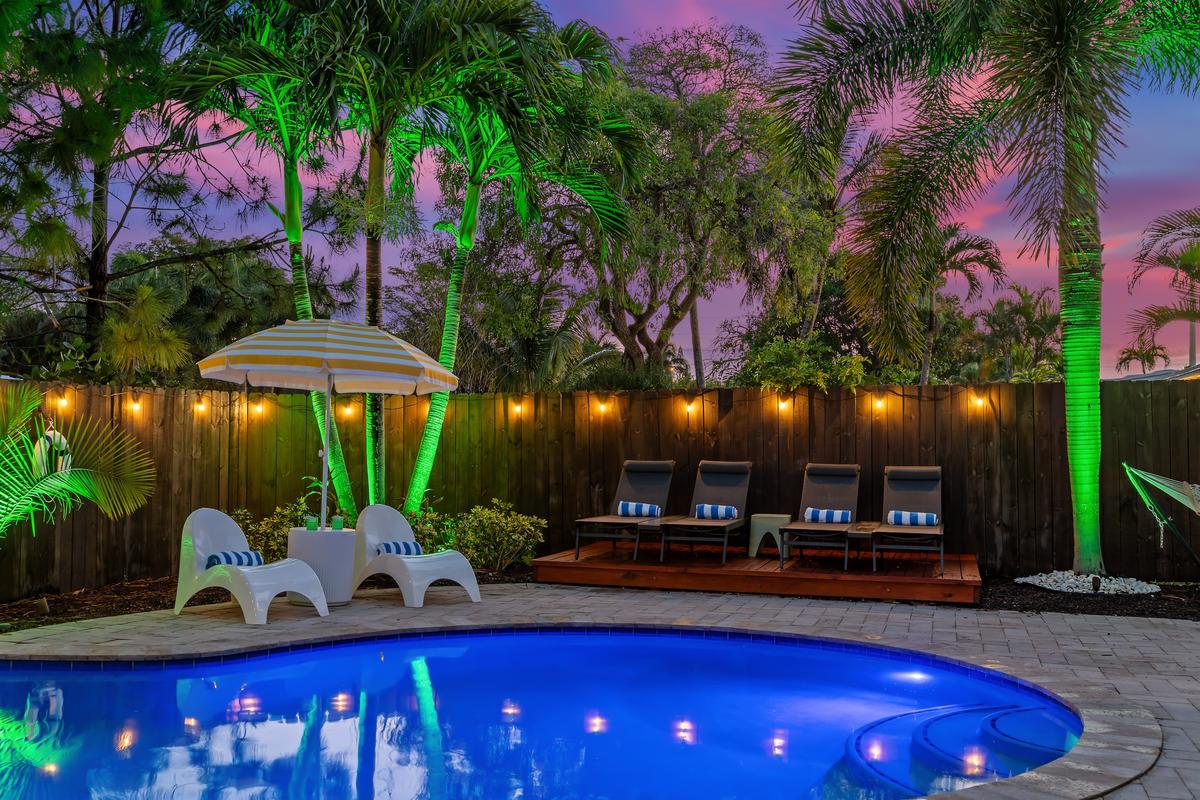 Late-night hangs by the pool? Always a great idea—grab a drink, hit the loungers, and vibe out with the lively night lighting.