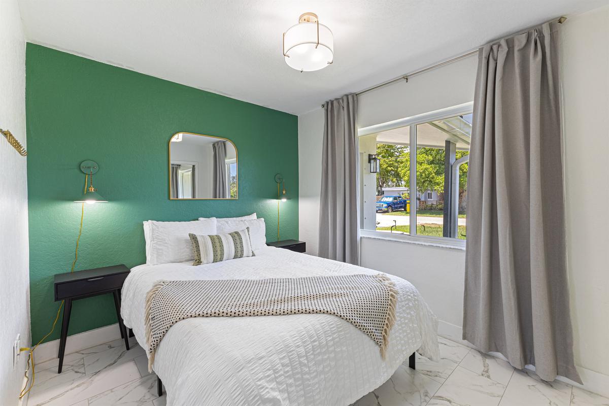 Third bedroom — Queen bed, plush bedding, and stylish touches.