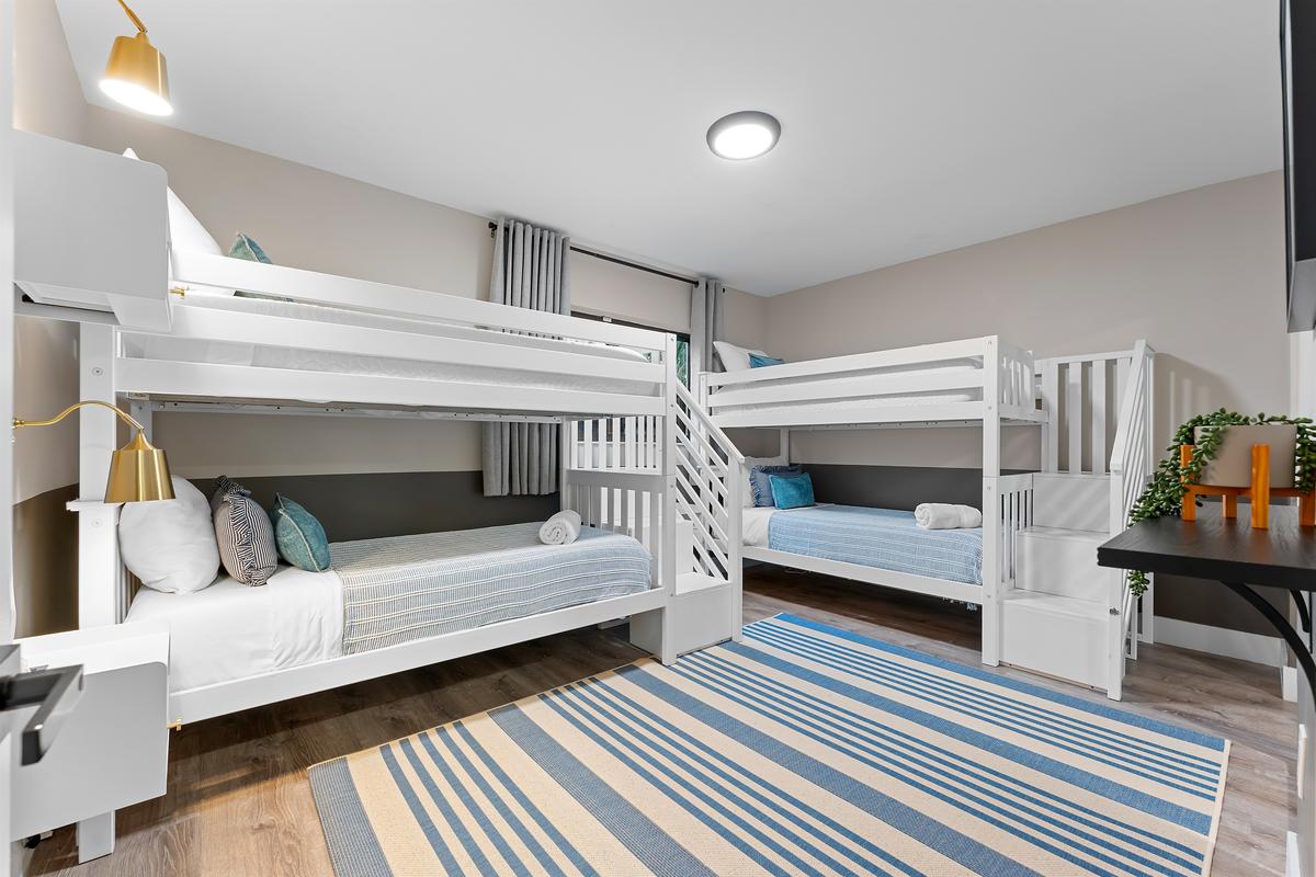 Bunk up! Four cozy twin beds make this room a fun zone for kids or groups.