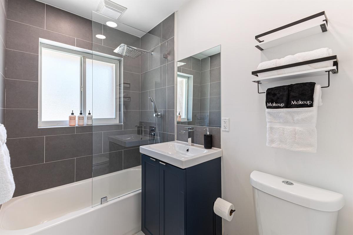 Third full bathroom shared for convenience and comfort.